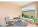 Comfortable screened patio featuring outdoor seating, ideal for enjoying the serene backyard view at 8303 Sw 82Nd Cir, Ocala, FL 34481