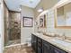 Beautiful bathroom with a double vanity, stone tile floor, and walk-in shower at 8447 Sw 82Nd Loop, Ocala, FL 34481
