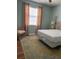 Bright bedroom featuring a large window and classic design elements at 8447 Sw 82Nd Loop, Ocala, FL 34481