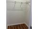 Walk-in closet featuring wood floors and wire shelving for storage at 8447 Sw 82Nd Loop, Ocala, FL 34481
