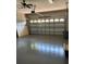 Spacious garage with concrete floors, a ceiling fan, and ample space for vehicles at 8447 Sw 82Nd Loop, Ocala, FL 34481