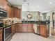 Well-appointed kitchen showcasing granite countertops, stainless steel appliances, and tiled backsplash at 8447 Sw 82Nd Loop, Ocala, FL 34481