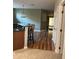 Bright and open kitchen featuring granite countertops, stainless steel appliances, and a breakfast bar at 8447 Sw 82Nd Loop, Ocala, FL 34481