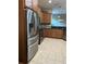 Spacious kitchen with stainless steel appliances, granite countertops, and wood cabinetry at 8447 Sw 82Nd Loop, Ocala, FL 34481