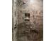 Modern shower with stone walls, glass door, and built-in shelving at 8447 Sw 82Nd Loop, Ocala, FL 34481