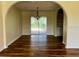Bright dining room with wood flooring, chandelier and sliding glass doors to backyard at 8770 Sw 196Th Terrace Rd, Dunnellon, FL 34432