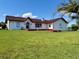 Charming single story home with a well-manicured lawn and vibrant, healthy plants at 8770 Sw 196Th Terrace Rd, Dunnellon, FL 34432