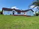 Charming single story home with a well-manicured lawn and vibrant, healthy plants at 8770 Sw 196Th Terrace Rd, Dunnellon, FL 34432