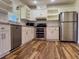 Modern kitchen with white cabinets, stainless steel appliances, and granite countertops at 8770 Sw 196Th Terrace Rd, Dunnellon, FL 34432