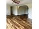 Bright living room features sleek flooring, an arched doorway, and ample space for entertaining at 8770 Sw 196Th Terrace Rd, Dunnellon, FL 34432