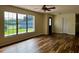 Bright living room boasts sleek flooring and a large window that lets in natural light at 8770 Sw 196Th Terrace Rd, Dunnellon, FL 34432