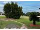 A well-maintained yard with greenery and stepping stones at 8770 Sw 196Th Terrace Rd, Dunnellon, FL 34432