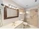 Bathroom featuring a glass-enclosed shower, vanity with mirror, and ceramic tile flooring at 8885 Sw 90Th Ave, Ocala, FL 34481