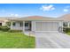 Charming single-story home featuring a two-car garage, a covered porch, and inviting curb appeal at 8885 Sw 90Th Ave, Ocala, FL 34481