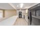 The kitchen has tile flooring, white cabinets, and modern appliances at 8885 Sw 90Th Ave, Ocala, FL 34481