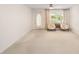 Bright living room with comfortable seating and a door leading to outdoor space at 8885 Sw 90Th Ave, Ocala, FL 34481