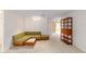 Open living room featuring unique sofa and classic shelving at 8885 Sw 90Th Ave, Ocala, FL 34481