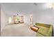 The living room has carpet flooring, natural light, and a door to the exterior at 8885 Sw 90Th Ave, Ocala, FL 34481