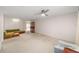 Open living room with neutral walls, classic shelving, and comfortable seating area at 8885 Sw 90Th Ave, Ocala, FL 34481