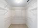 Spacious walk-in closet with wire shelving, providing ample storage space at 8885 Sw 90Th Ave, Ocala, FL 34481