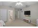 Inviting bedroom with connected bathroom and a wall-mounted TV at 9175 Se 7Th Avenue Rd, Ocala, FL 34480