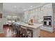 Bright, modern kitchen featuring a large island with seating, stainless steel appliances, and custom cabinetry at 9175 Se 7Th Avenue Rd, Ocala, FL 34480