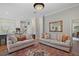 Open-concept living room with neutral walls, a decorative rug, and plenty of seating for Gathering and guests at 9175 Se 7Th Avenue Rd, Ocala, FL 34480