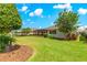 Well-kept backyard with a screened-in lanai and mature landscaping for privacy at 9203 Sw 97Th Cir, Ocala, FL 34481