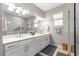 Bathroom with dual sinks, a spacious shower, and a large mirror for a luxurious feel at 9203 Sw 97Th Cir, Ocala, FL 34481