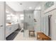 Bathroom featuring double sinks, a walk-in shower, and a spacious layout at 9203 Sw 97Th Cir, Ocala, FL 34481