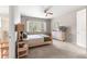 Bright bedroom with a queen bed, a window with a beautiful view, and a calm atmosphere at 9203 Sw 97Th Cir, Ocala, FL 34481