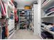 View of walk-in closet featuring shelving, hanging clothes, and storage at 9203 Sw 97Th Cir, Ocala, FL 34481