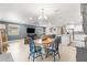 Open concept dining area with blue accent wall adjacent to the kitchen and living space at 9203 Sw 97Th Cir, Ocala, FL 34481
