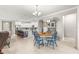 Bright dining area with blue chairs, adjacent to the kitchen, and open to the living space at 9203 Sw 97Th Cir, Ocala, FL 34481