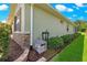 Home exterior showing siding, brick accent, and landscaping with blue skies at 9203 Sw 97Th Cir, Ocala, FL 34481