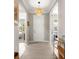 Bright foyer featuring tile floors, stylish lighting, and access to various rooms in the home at 9203 Sw 97Th Cir, Ocala, FL 34481