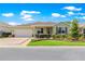 Charming single-story home with a well-manicured lawn, beautiful landscaping, and an attached two-car garage at 9203 Sw 97Th Cir, Ocala, FL 34481