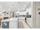 Beautiful kitchen featuring a large island, white cabinets, stainless steel appliances, and modern finishes at 9203 Sw 97Th Cir, Ocala, FL 34481