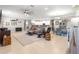 Open living space with tile flooring, neutral walls, a large rug, and a modern ceiling fan at 9203 Sw 97Th Cir, Ocala, FL 34481