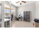 Office with a large window, a modern desk, and a bookcase with storage at 9203 Sw 97Th Cir, Ocala, FL 34481