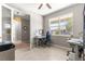 Bright office space with large windows, desk, and neutral tones, perfect for working from home at 9203 Sw 97Th Cir, Ocala, FL 34481