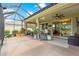 Screened-in patio featuring furniture, plants, and an outdoor living space at 9203 Sw 97Th Cir, Ocala, FL 34481