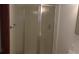 Bathroom featuring a shower with glass doors at 9960 Sw 103Rd Ln, Ocala, FL 34481