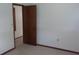 Bedroom with neutral carpet, open door, and fresh paint at 9960 Sw 103Rd Ln, Ocala, FL 34481