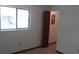 Bedroom with a window, door, and neutral carpet at 9960 Sw 103Rd Ln, Ocala, FL 34481