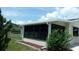 Bright sunroom with multiple windows, perfect for enjoying the outdoors from the comfort of home at 9960 Sw 103Rd Ln, Ocala, FL 34481