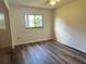 Bedroom featuring wood flooring and a serene ambiance at 10080 Sw 97Th Ct, Ocala, FL 34481