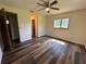 Comfortable Bedroom with an overhead fan and wood flooring at 10080 Sw 97Th Ct, Ocala, FL 34481