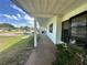 Covered porch, perfect for enjoying the outdoors, and parking space with an electric vehicle charger at 10080 Sw 97Th Ct, Ocala, FL 34481