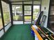 Screened-in porch with the materials to do the flooring, ample natural light, and spacious at 10080 Sw 97Th Ct, Ocala, FL 34481